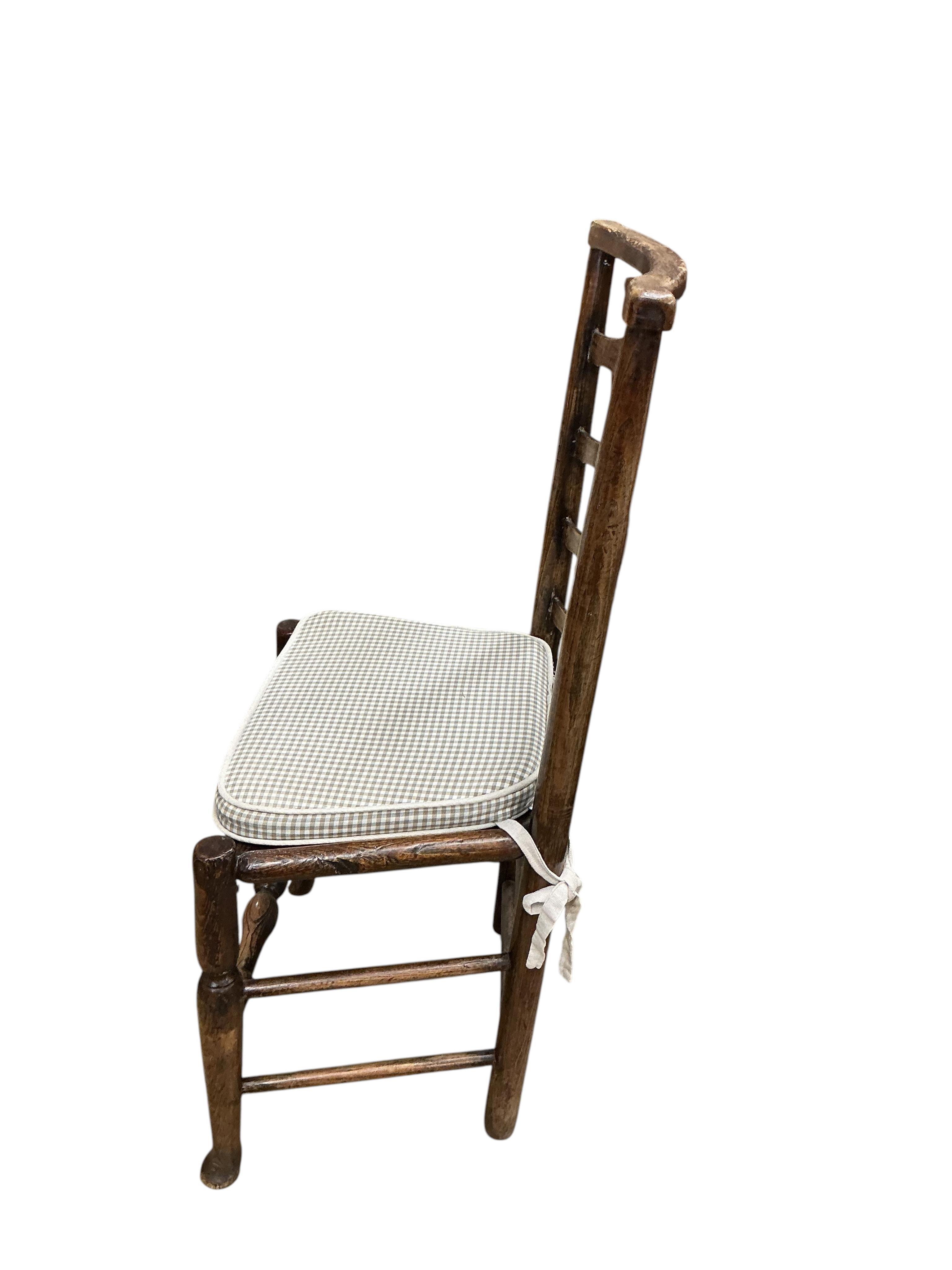 A harlequin set of six early 19th century Provincial ash and elm ladderback rush seated dining chairs (a.f.)